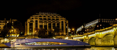Le Paris dinner cruise boat on the Seine with La Samaritaine store lit at night