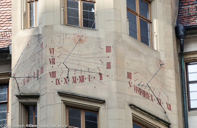 Sundials on three sides of a building
