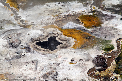 Mineral deposits & small geyser in the hot stream