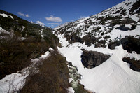 A stream running through the snowy White Pass summit