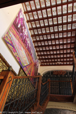 Tile ceiling and mural with staircase