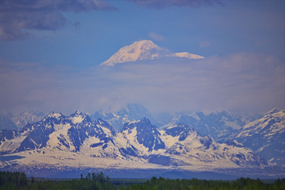 Denali peak above the clouds and the Alaska range