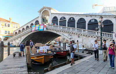 Freight boats in front of the Rialto Bridge