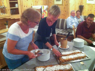 Peggy and Jennifer cut the Apple and Cheese Strudel for dessert at dinner