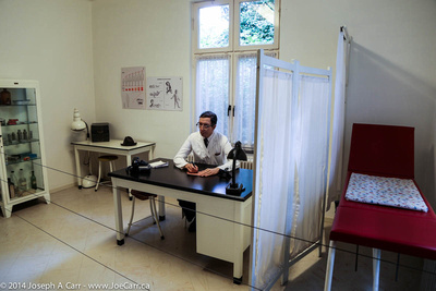 Doctor (mannequin) in his office and exam room