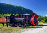 Vintage steam engine and rotary snowplow