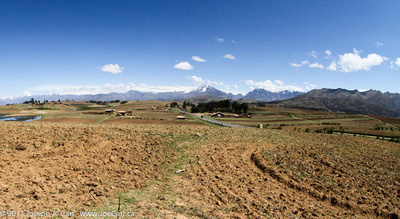 Andes mountains behind a valley used for agriculture