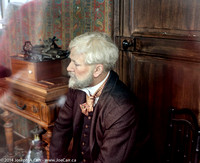 Gustave Eiffel sitting in his suite atop his tower