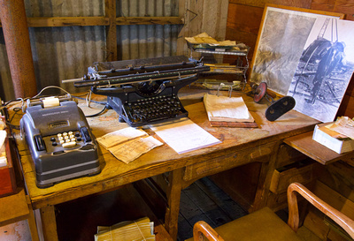 Remington adding machine and typewriter on old desk