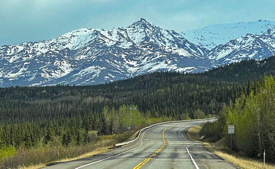 We see snow-capped mountains on our way to Denali